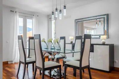a living room with a couch and a table at Sun Hills Panoramic Views in Funchal