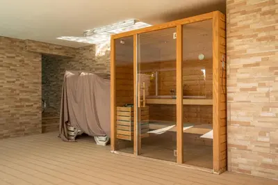 a room with a wooden closet in a brick wall at Casa Chloe Luxury Oceanview Penthouse in Lagos