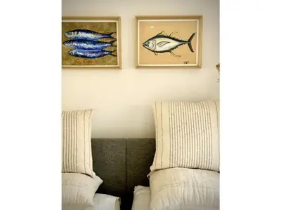 a living room with two chairs and a couch at Fisherhouse23 Comfortable holiday residence in Câmara de Lobos