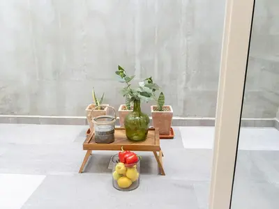 a table with potted plants and fruit on it at Fisherhouse23 Comfortable holiday residence in Câmara de Lobos