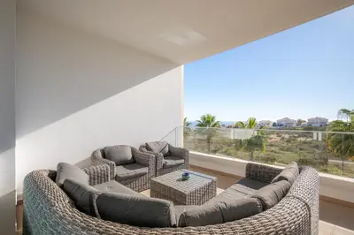 a living room with two couches and a large window at Casa Lilou - Luxury Oceanview Penthouse in Lagos