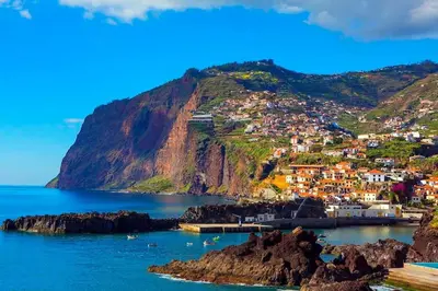 a view of the town of positano on a mountain at Madeira property in Câmara de Lobos