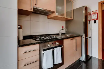 a kitchen with a stove and a sink at Monumental Lidoview in Funchal