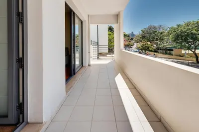 an empty corridor of a building with a balcony at Monumental Lidoview in Funchal