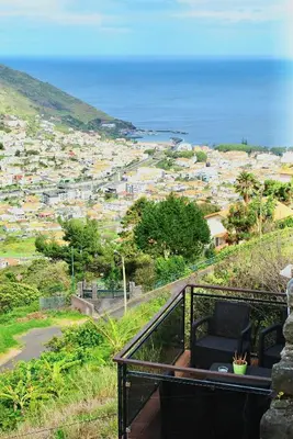 a balcony with a view of a city at Casa da Adega in Machico