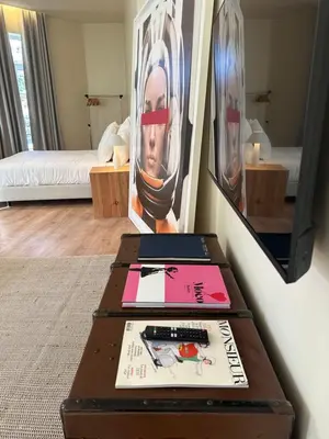 a room with two ottoman tables and a television at Downtown collection apartments II in Funchal