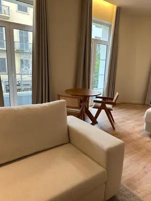 a living room with a couch and a table at Downtown collection apartments II in Funchal