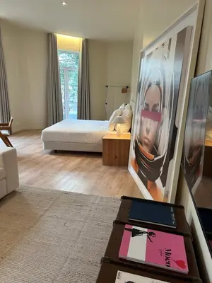 a living room with a bed and a table with a box at Downtown collection apartments II in Funchal