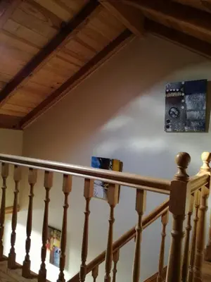 a stair railing with two speakers on the wall at Herdade do Pedregal in Ponta do Pargo