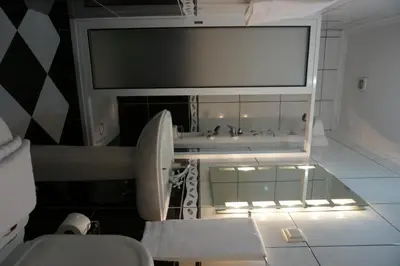 a bathroom with a sink and a toilet at Herdade do Pedregal in Ponta do Pargo