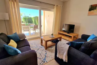 a living room with two couches and a television at Deluxe 3 bedroom townhouse - Quinta da Atalaia in Lagos