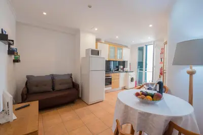 a living room with a table with a bowl of fruit at Apartments Madeira Old Town in Funchal