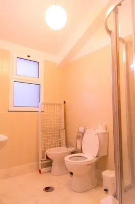 a bathroom with a toilet and a sink at Apartments Madeira Old Town in Funchal