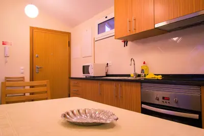 a kitchen with a table with a bowl on it at Apartments Madeira Old Town in Funchal