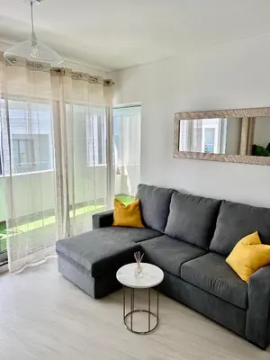 a living room with a couch and a table at Lido Branca by Olá Madeira in Funchal