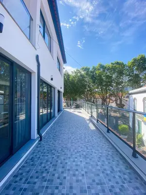 an empty walkway next to a building at Village Square Coastal Apartment 2F in Machico