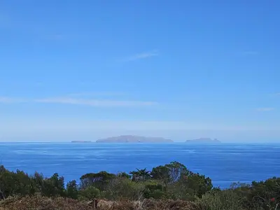 a large body of water with islands in the distance at Discovery 1 in Machico