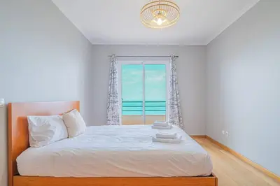 an aerial view of a city and the ocean at Ocean View Apartment in Caniço de Baixo in Funchal