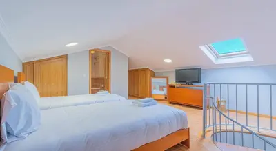 a bathroom with a white toilet and a sink at Ocean View Apartment in Caniço de Baixo in Funchal