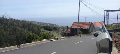 a car driving down a road on a mountain at Casa Monte de Paz in Calheta