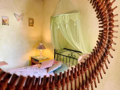 a bedroom with a bed with a canopy at Beautiful sea view in Luz