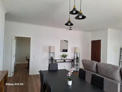 a living room with a couch and a table at Figueira's House By the Atlantic in Ponta do Sol