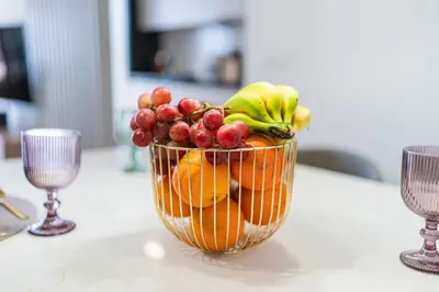 a bowl of fruit sitting on top of a table at SeaLaVie Apartment in Funchal