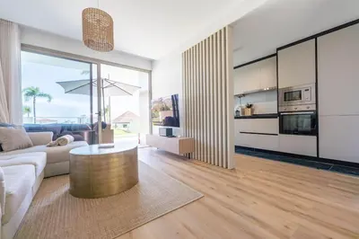 a living room with a couch and a table at SeaLaVie Apartment in Funchal