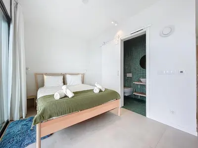 a bedroom with a bed and a bathroom at Mar Yam Garden by Atlantic Holiday in Arco de São Jorge