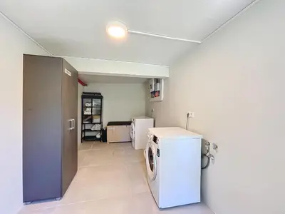 a laundry room with a washer and dryer at Mar Yam Garden by Atlantic Holiday in Arco de São Jorge