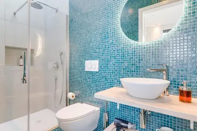 a bathroom with a sink and a toilet and a mirror at Mar Yam View by Atlantic Holiday in Arco de São Jorge