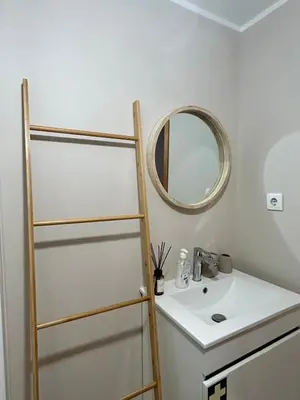 a bathroom with a sink and a mirror at Seminario Classic Apartment in Funchal