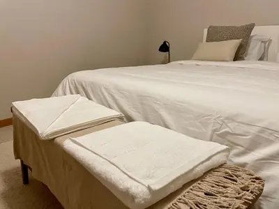 a bedroom with two beds with white sheets at Seminario Classic Apartment in Funchal