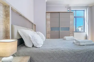 a bathroom with a sink and a mirror at Old Town T1 Apartment in Funchal