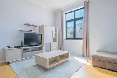 a living room with a tv and a couch at Old Town T1 Apartment in Funchal