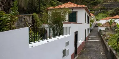 a street in a town with white buildings at JMF House in São Vicente