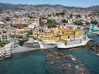 an aerial view of a city with a body of water at Sao Thiago House Madeira in Funchal
