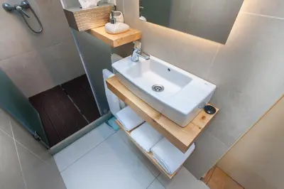 a bathroom with a sink and a mirror at Sao Thiago House Madeira in Funchal