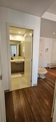 a room with a bathroom with a sink and a mirror at Plaza Apartamento in Funchal