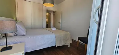 a small bedroom with a bed with a stuffed animal on it at Plaza Apartamento in Funchal