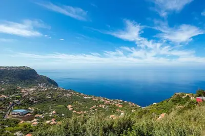 a view of the ocean from a mountain at Sunparadise in Arco da Calheta