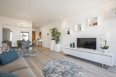 a living room with a couch and a tv at Contemporary Residence B by Homie in Funchal
