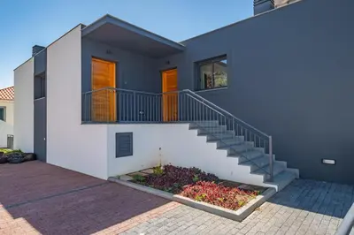 a house with a staircase in front of it at Contemporary Residence B by Homie in Funchal