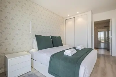 a bedroom with a bed with two towels on it at Contemporary Residence B by Homie in Funchal