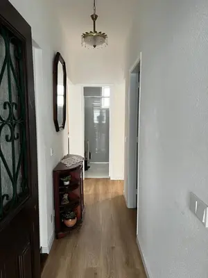 a hallway of a home with a chandelier at Home Away From Home in Funchal