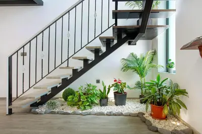 a staircase with plants in a house at Refugio Do Lourinho in Calheta