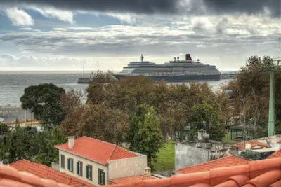 a cruise ship is docked in the water at Old Town Apartment in Funchal