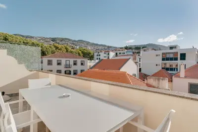 a view of a city from the balcony of a building at Old Town Apartment in Funchal