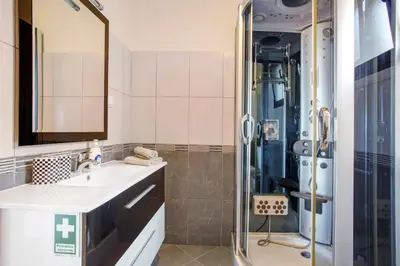 a bathroom with a sink and a shower at Casa da Bemposta in Machico