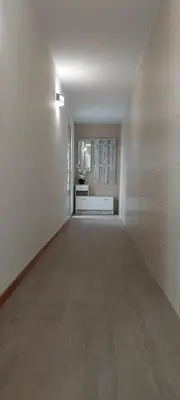 a large empty room with a white wall at Villa City in Funchal